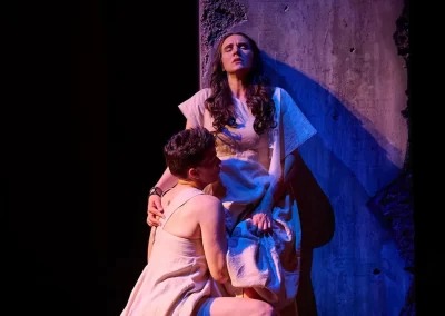 Dramatic theatre scene with two actors in ancient Roman costumes, flowing. From the opera "Pomegranate" with the Canadian Opera Company 2023.